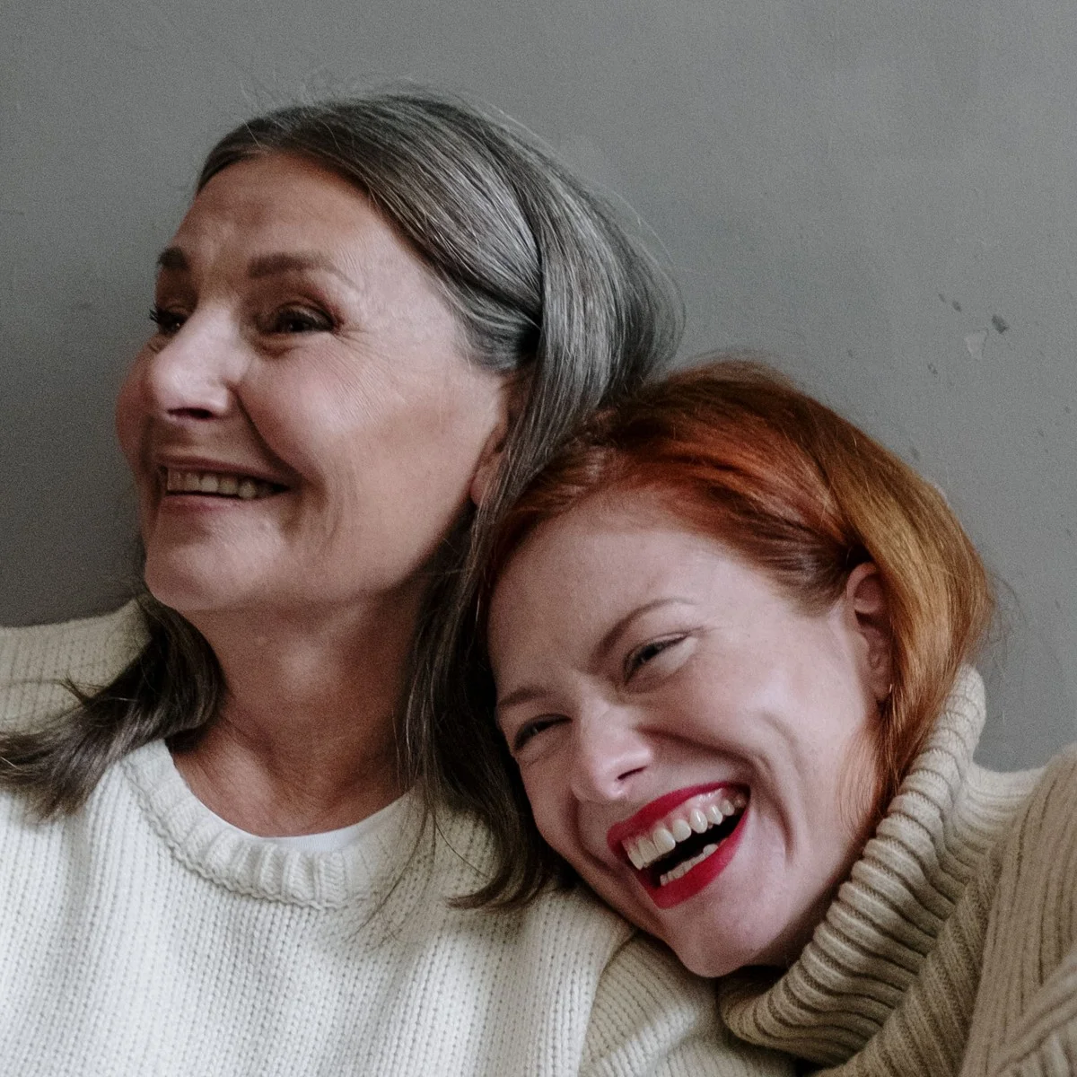 Women laughing together, supporting each other through menopause